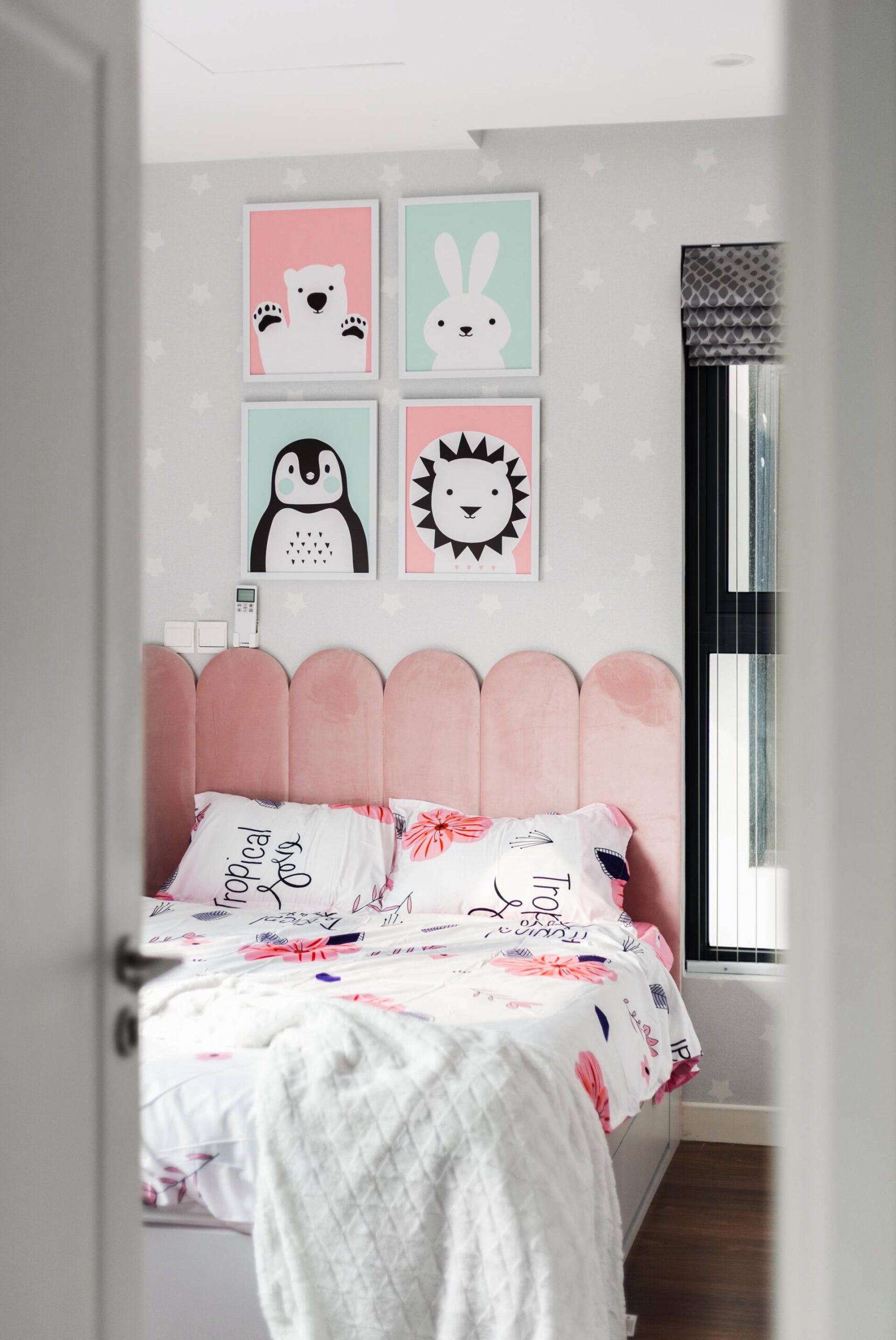 A lovely animal-shaped headboard adorns the little girl's private space.