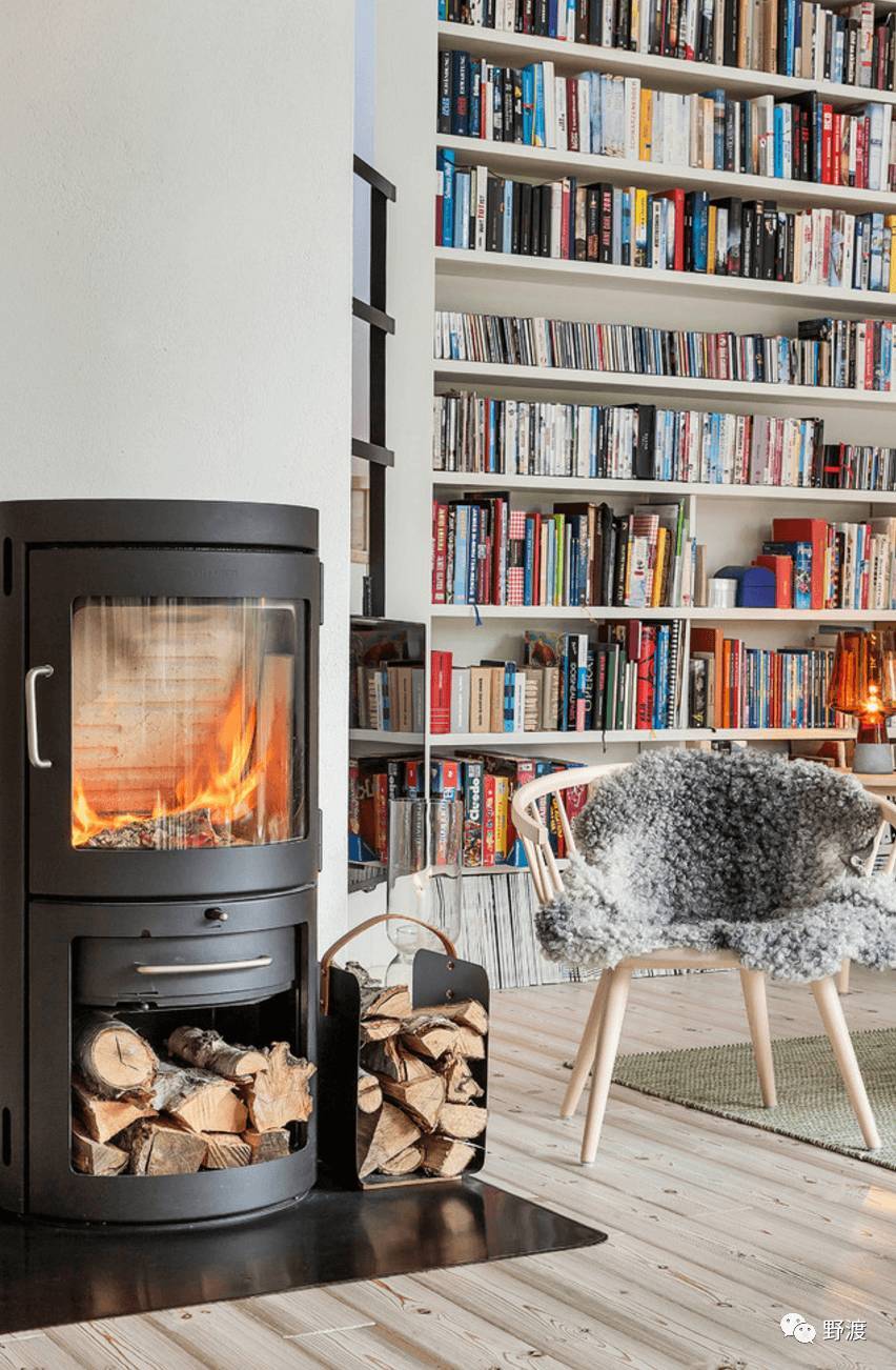 Scandinavian style is transformed by the fireplace.