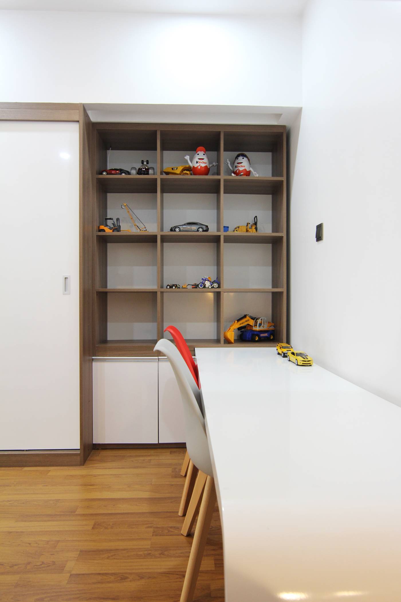 Wall cabinets are set up to make the bedroom area look larger.
