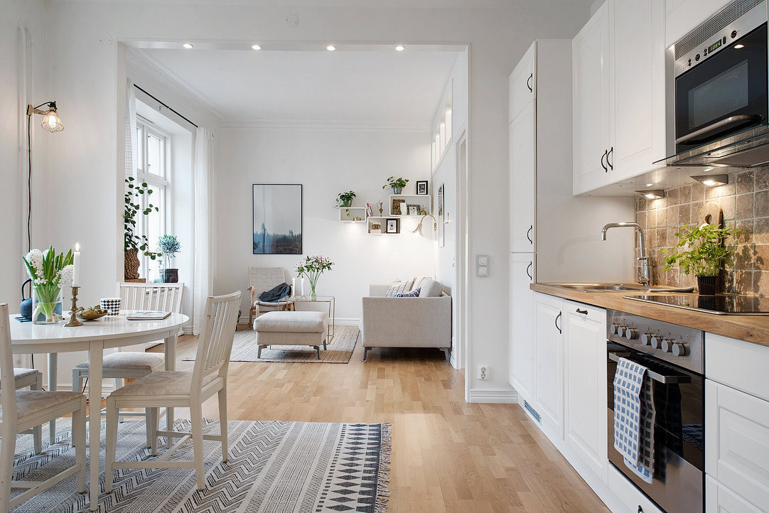Small kitchen connected to the living room. Everything is beautiful and perfect thanks to the gentle arrangement of interior.