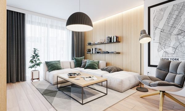 The living room is arranged next to a window that lets in warm sunlight and bright colors from potted plants.