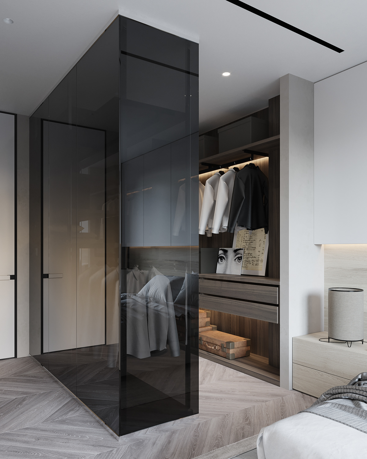 The wardrobe and changing areas are separated by a large glass wall, contributing to expanding the space view.