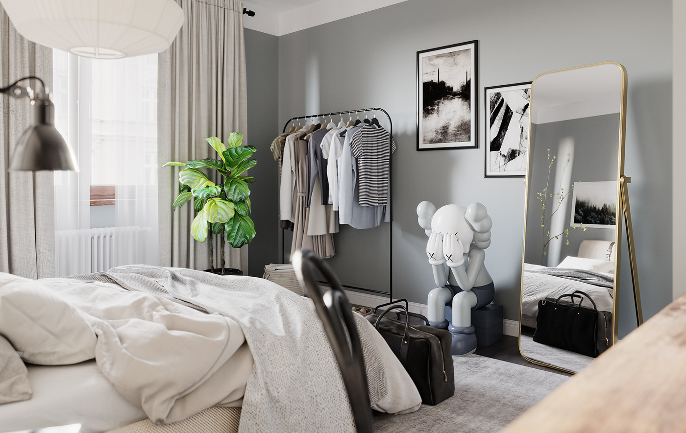Instead of a wardrobe, the owner prefers a cloth rack to save area to the bedroom.
