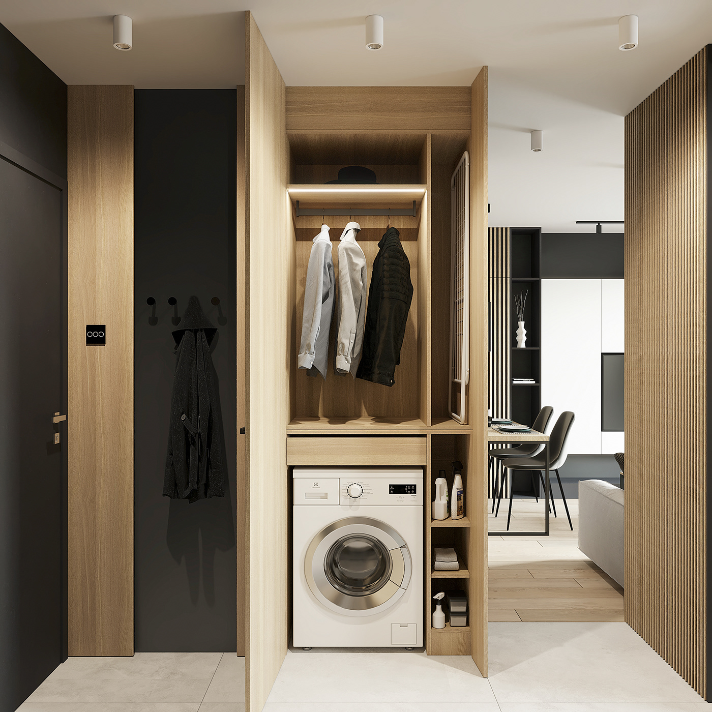 Inside the closet is a place to do laundry and hang clothes, making efficient use of the 40 m2 apartment's space.