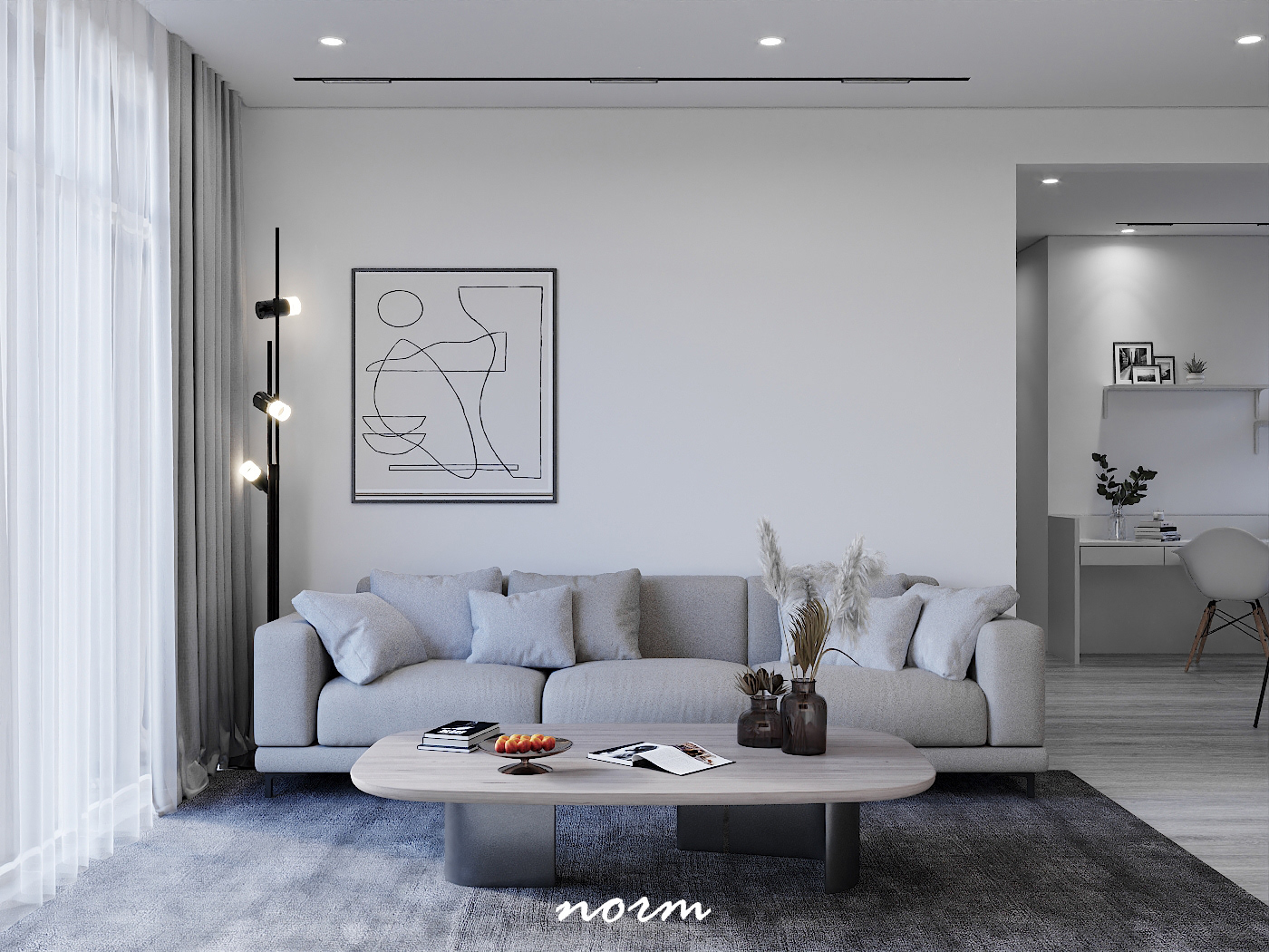 A dark gray rug and light gray sofa complement each other perfectly in this room, building a sense of intimacy and comfort. With natural light snags, this will be a great spot for family members to read and talk.
